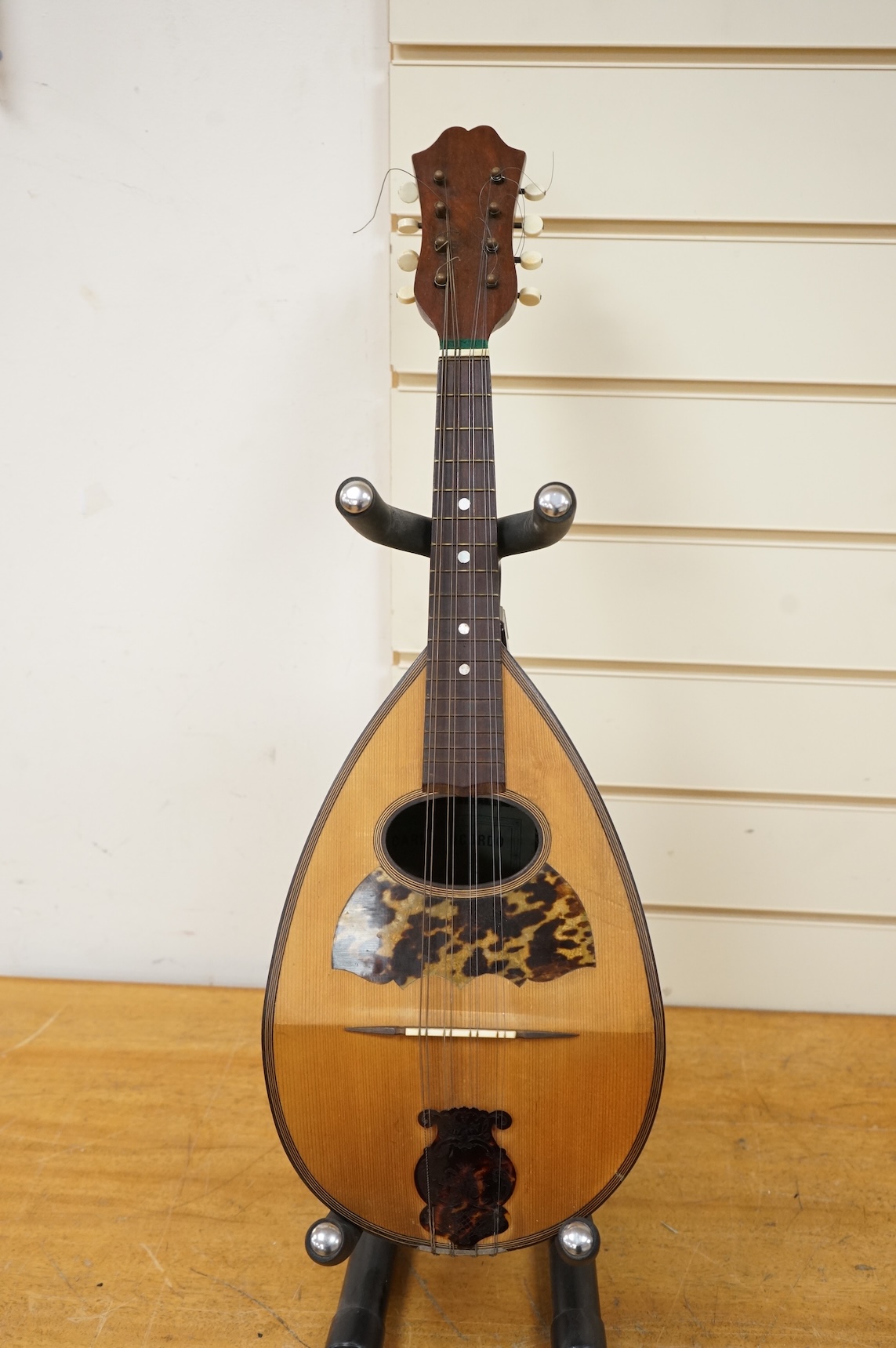An early 20th century Italian cased mandolin by Carlo Ricordo, Napoli, with spruce soundboard inlaid with tortoiseshell